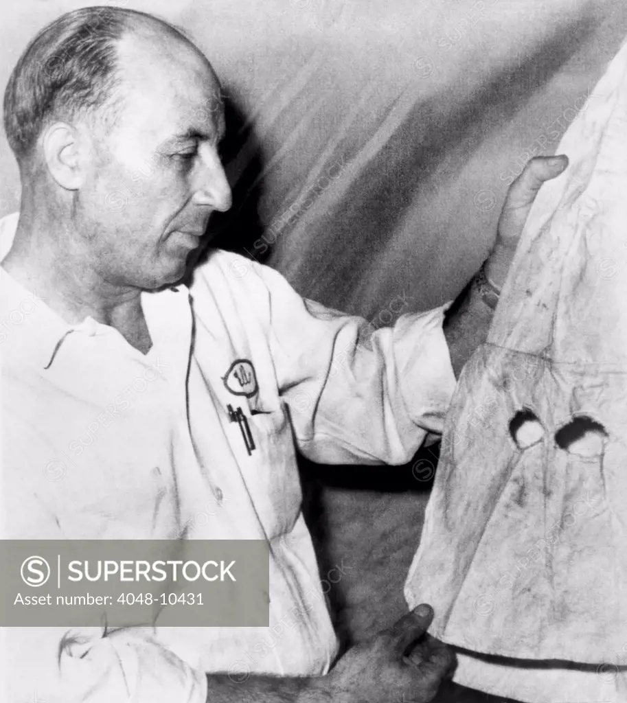 Supreme Court Justice Hugo Black's KKK costume. Ku Klux Klan Cyclops, Bill Chappel, holds a hood he claimed was worn by Hugo Black when he belonged to the Klan in the 1920s. As a young Alabama politician, Black claimed he joined the Klan to get votes, and later regretted his membership. Nov. 6, 1965.