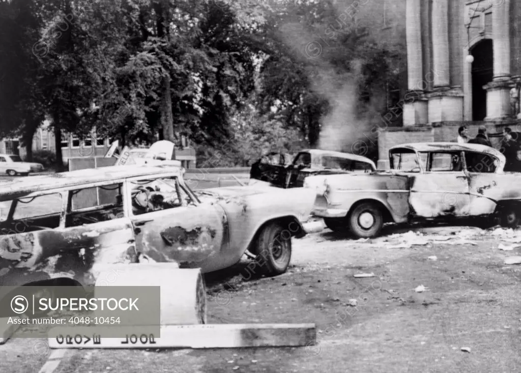 Segregationist riot at Old Miss. Burned out cars at University of Mississippi campus after a night of violence protesting the admission of James Meredith, an African American student. Oct. 1, 1962.