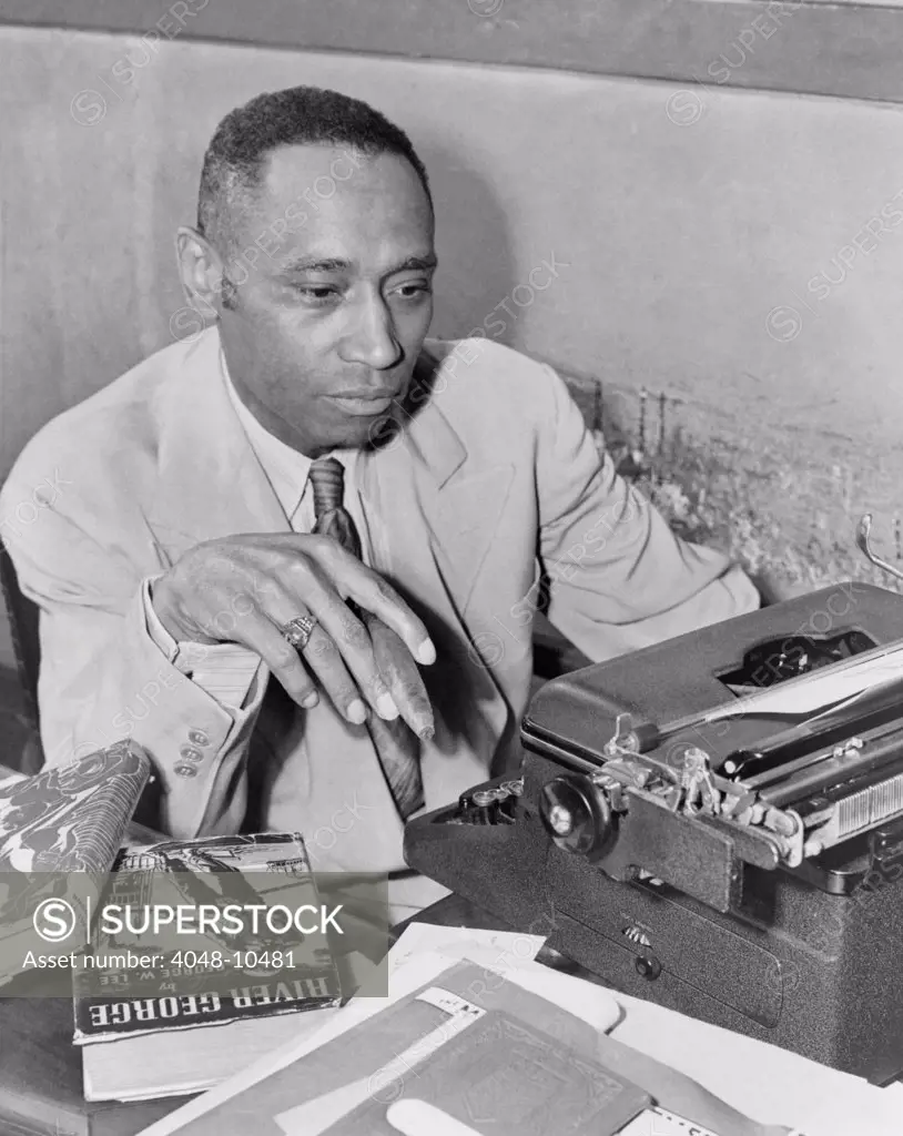 African American author George Washington Lee. He poses with his 1937 novel 'River George', about a young African American World War I veteran who returns home to injustice and is ultimately lynched. 1945.