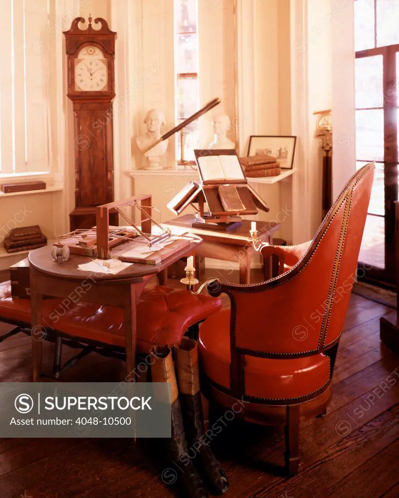 Monticello, the home built by Thomas Jefferson in the 1770s. Jefferson's desk with his invention to create duplicates of his correspondence. Also there is a book stand, grandfather clock, and telescope. Ca. 1990.
