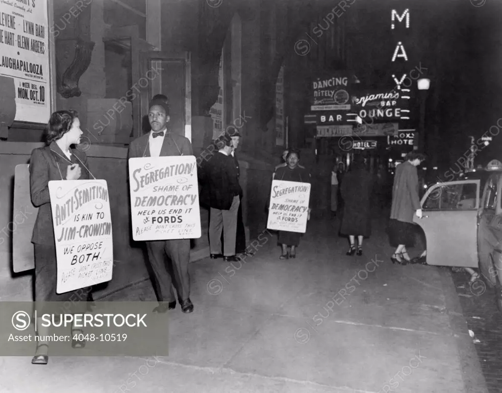 Bayard Rustin, Mrs. Bowen Jackson, and Mrs. Earl Williams picket the segregated Ford's Theatre in Baltimore, Maryland. 1948.