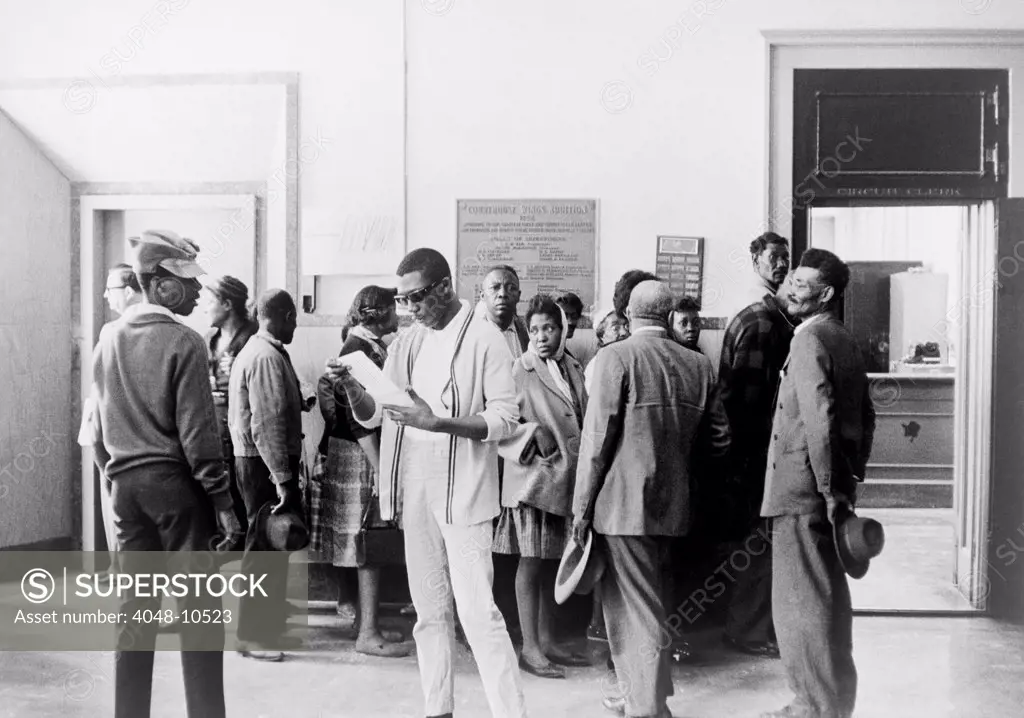 Voter registration drive. African Americans wait at the Circuit Court to register to vote in Mississippi. Ca. 1960s.
