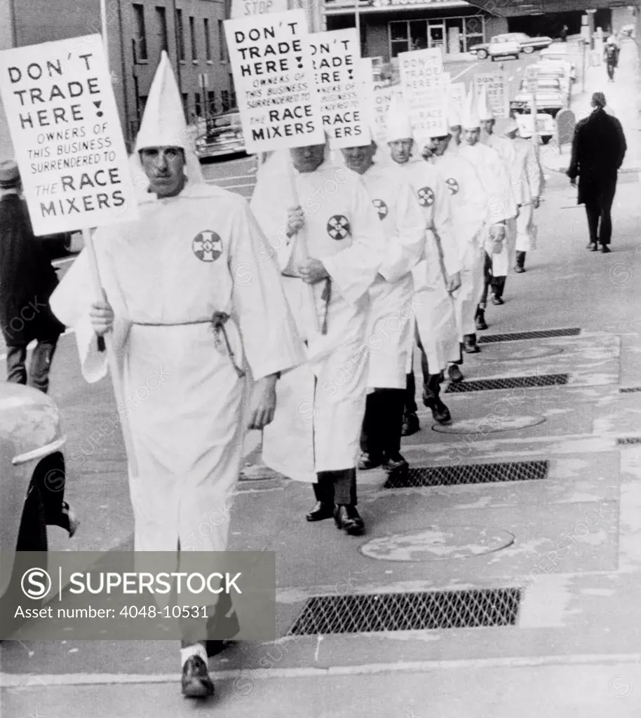 Ku Klux Klansmen picket newly desegregated hotel in Albany, Georgia. KKK was a militant minority intimidated moderates to resist racial integration of public facilities. Jan. 25, 1964.
