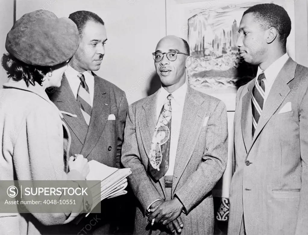 NAACP leaders during press conference at their New York City headquarters. L-R: Roy Wilkins, Heman Sweatt, Robert L. Carter. 1950.