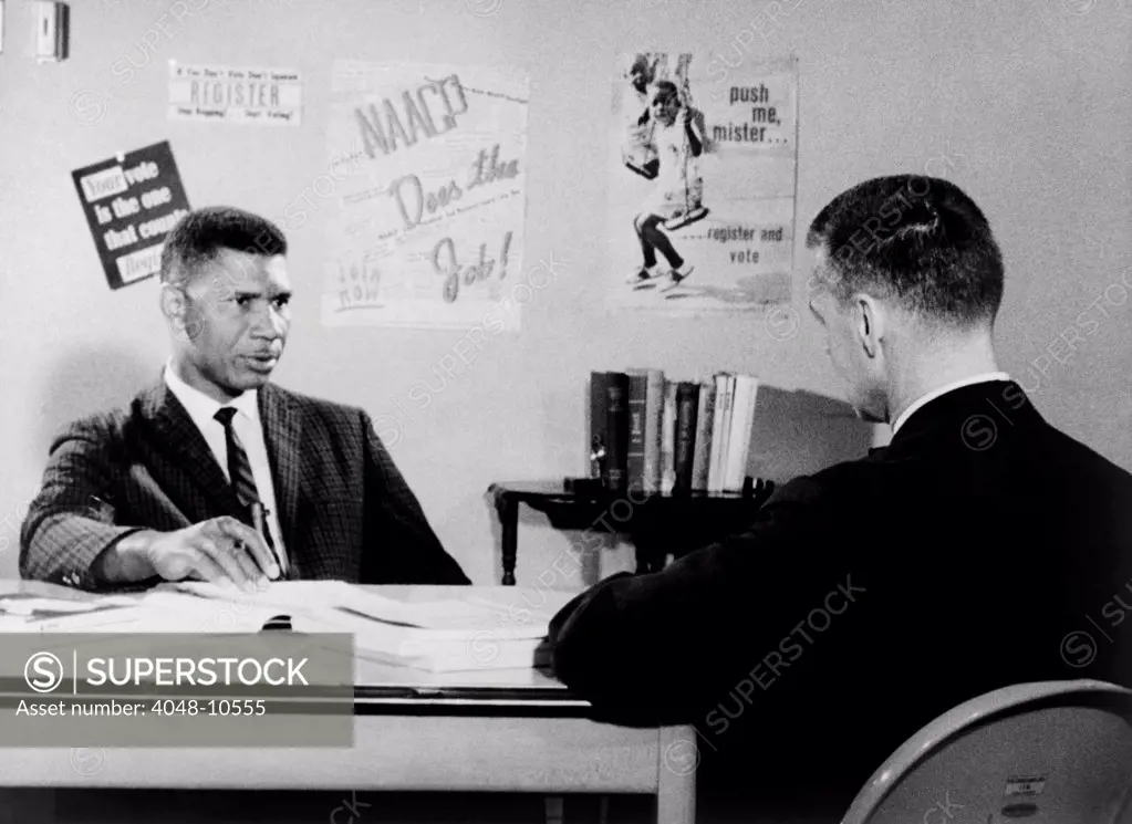 Medgar Evers, NAACP leader in Mississippi, being interviewed by Bill Peters. Peters (right) was an award-winning journalist who reported on the American civil rights movement. 1963.
