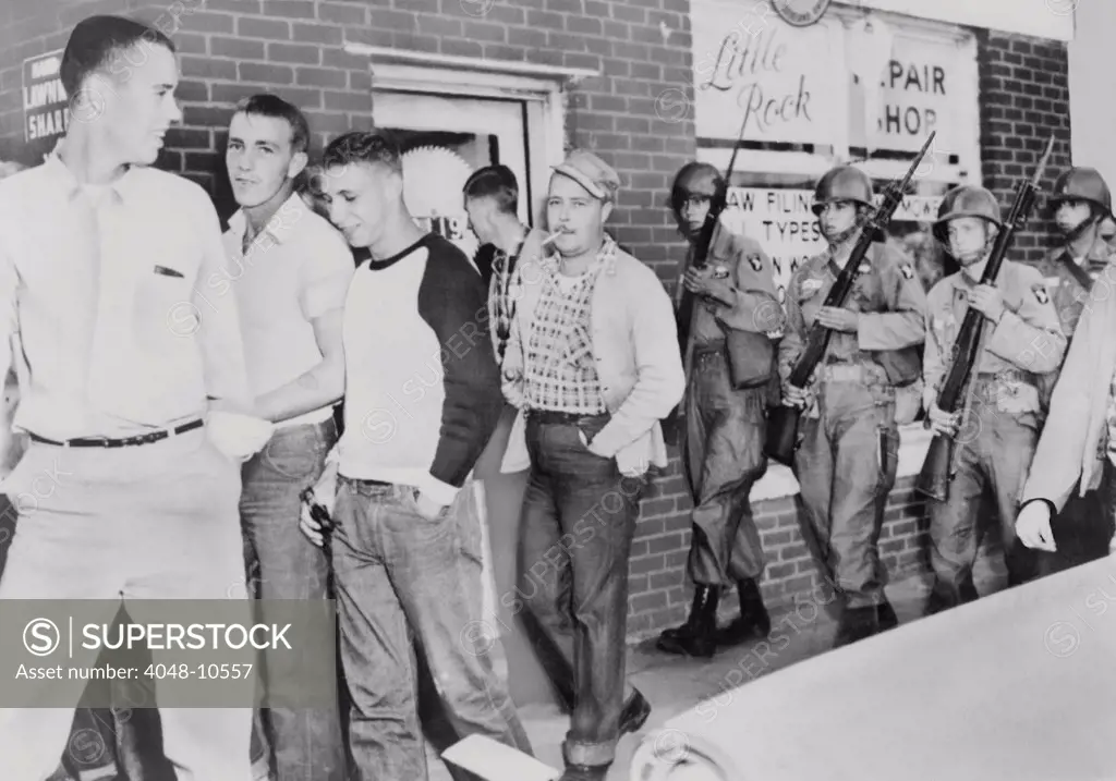 Troops of 101st Airborne Division move a crowd of White young men away from in front of Central High School in Little Rock, Arkansas. Sept.-Oct. 1957.