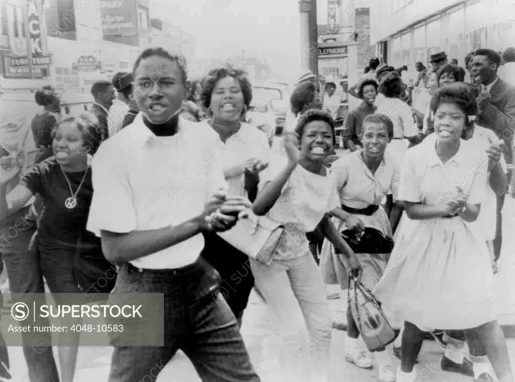 Young African American demonstrators march in downtown Birmingham, Alabama. During the SCLC 'Birmingham Movement,' children and teens were encouraged in protest and be arrested, in order to clog the city's legal system and create bad publicity. May 7, 1963.