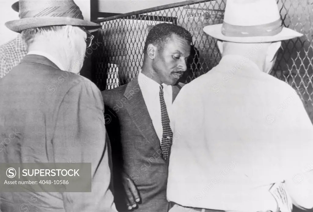 Civil Rights leader Fred Shuttlesworth being booked at the Birmingham Police Station in connection with attempts to desegregate buses. May 19, 1961.