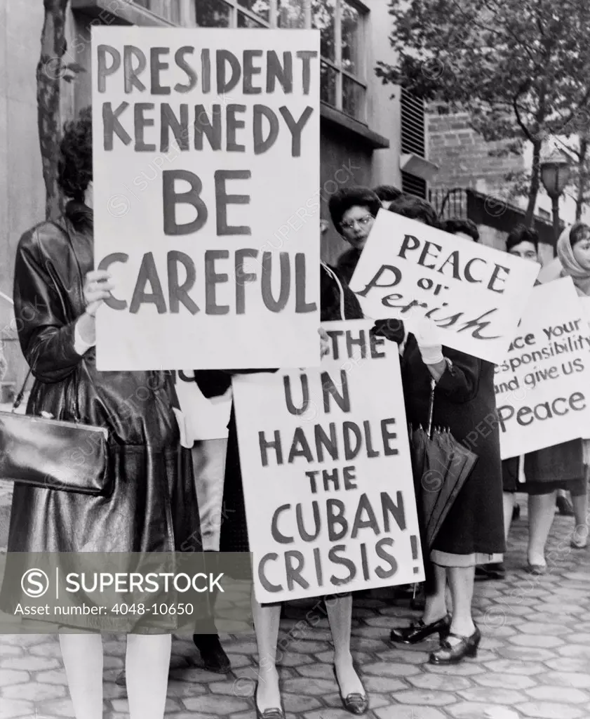 Women Strike for Peace. Some of the 800 women demonstrators holding placards reading 'President Kennedy Be Careful' and 'Let the UN handle the Cuban Crisis'. October 1962.