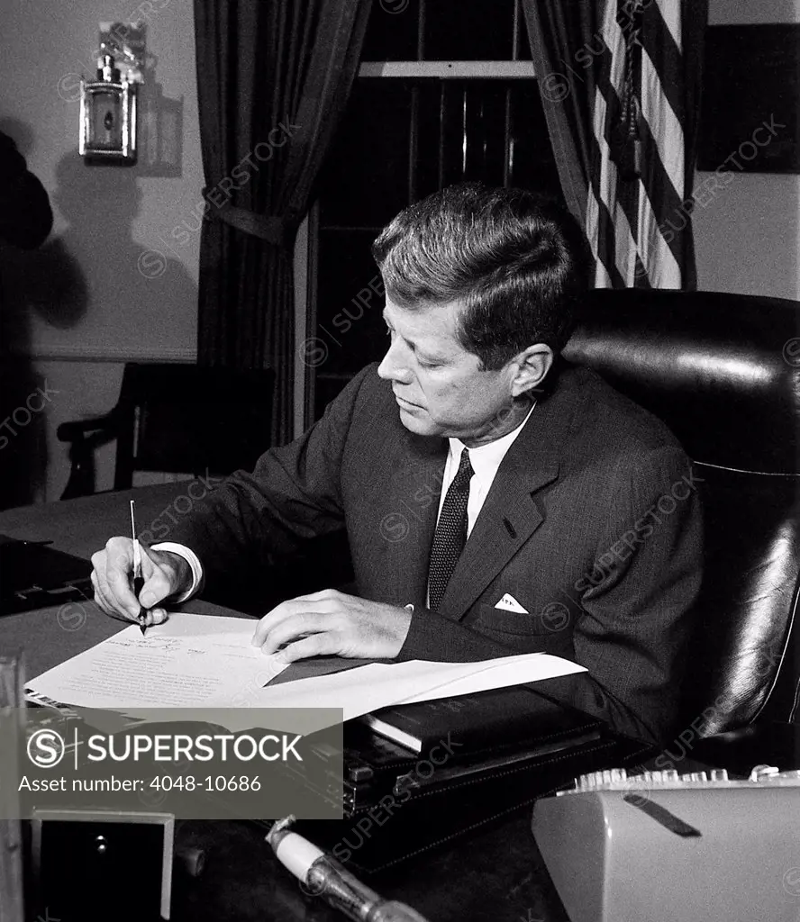 President Kennedy signing Cuba Quarantine Proclamation. The US Navy blockade would prevent the delivery of additional Soviet missiles to the Communist island nation. Oct. 23, 1962.