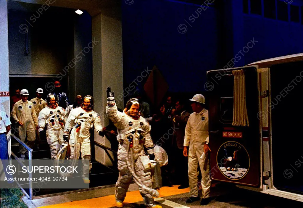 Apollo 11 crew in Spacesuits travel to launch site. R-L: Lead by Neil Armstrong, mission Commander, Command Module Pilot Michael Collins, and Lunar Module pilot Edwin Aldrin. July 16, 1969.