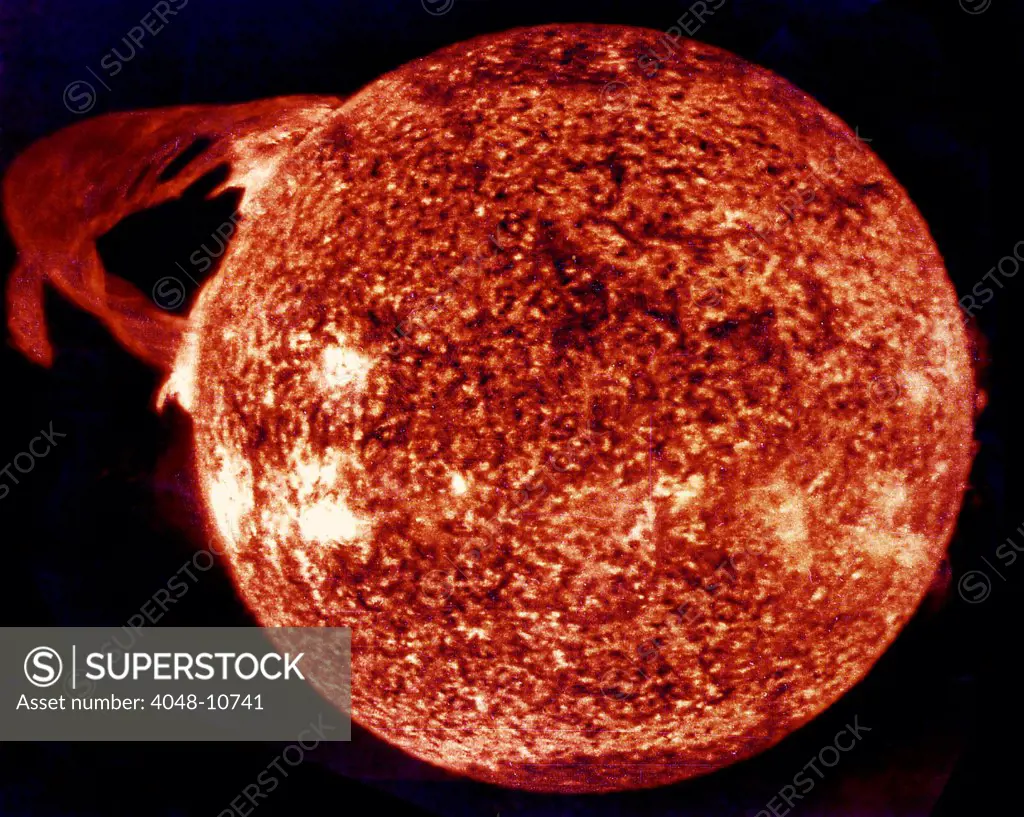 Ultraviolet exposure of colossal eruption on the Sun. This solar prominence, one of the largest in 25 years, erupted over 300,000 miles into space. The image is color-enhanced was photographed during the Skylab-4 mission by the Apollo Telescope. December 19, 1973.