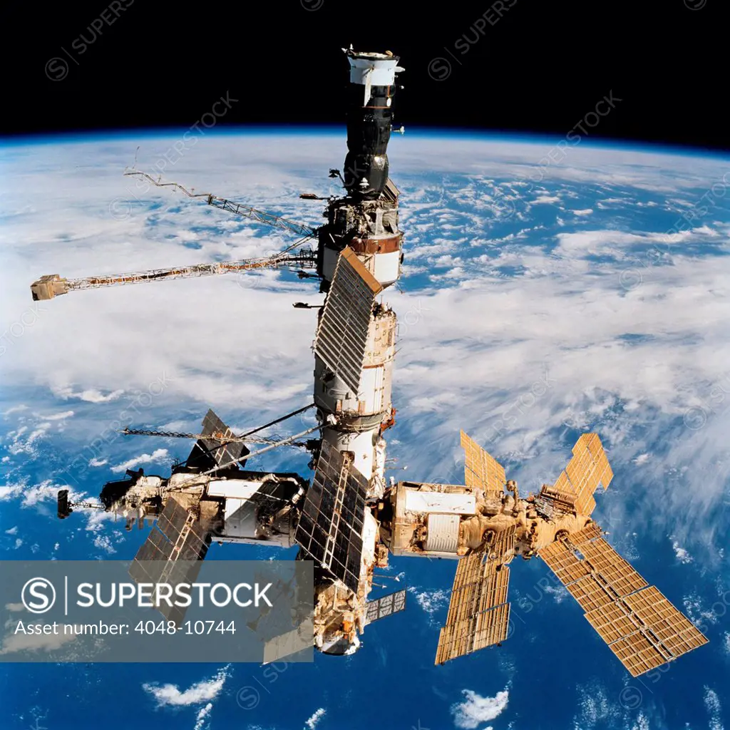 Russian Space Station Mir. Photo was taken by the crew of space shuttle Atlantis after undocking from the station. Oct. 20, 1997. At top is a docked Soyuz spacecraft. Oct. 20, 1997.