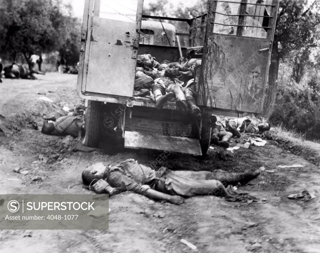A truckload of dead Chinese soldiers on the Nanyuan Road, killed by a hidden machine gun as they attempted to escort a general and three officers to safety. The soldiers lying outside the truck attempted to make the ditch at the side of the road. 8/25/37.