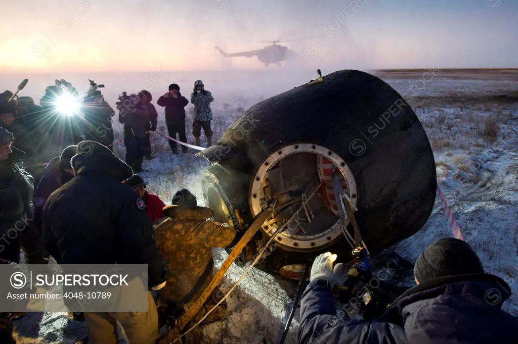 Soyuz TMA-02M spacecraft is opened by Russian land crew in Kazakhstan. The capsule returned International Space Station Expedition 29 after five months in space. Nov. 21, 2011.