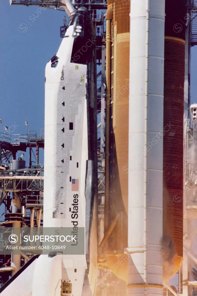 Space shuttle Challenger disaster. Grey-brown smoke on the right side of the Solid Rocket Booster, line directly across from the letter 'U' in United States, was the first visible sign a joint breach occurred. Jan. 28, 1986.