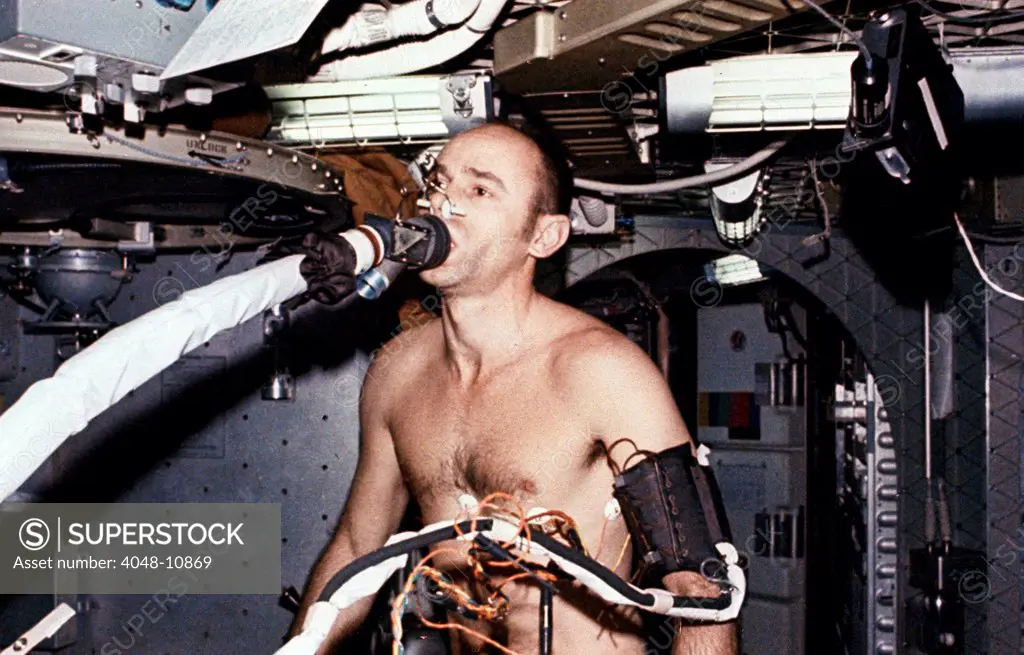 Skylab 3 Astronaut Allen Bean on the ergometer, breathing into the metabolic analyzer. The experiment obtained information on astronauts' physiological condition in zero gravity. July 28 to Sept. 25, 1973.