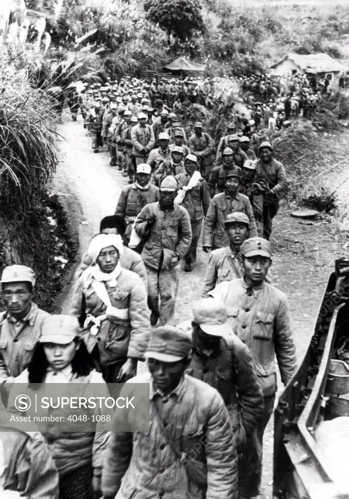 Vietnamese nationalist soldiers heading toward a French internment center during the First Indochina War, Saigon, Vietnam, 1949.