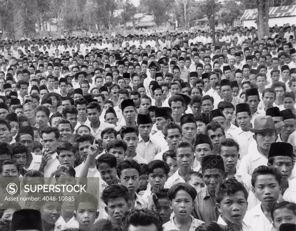 Indonesians in an  anti-Sukarno rally in Batu Sankar, Sumatra. They protested President Sukarno's consolidation of dictatorial powers. 1958.