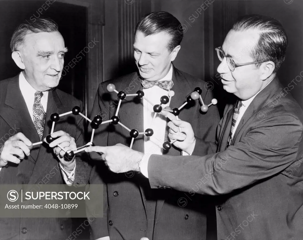 Scientists with a model of the molecular structure of cortisone. Senator Joseph O'Mahoney (center), with National Institute of Health scientists' Dr. Floyd S. Daft, and Dr. Joseph J. Bunim. 1956 July 17, 1956.