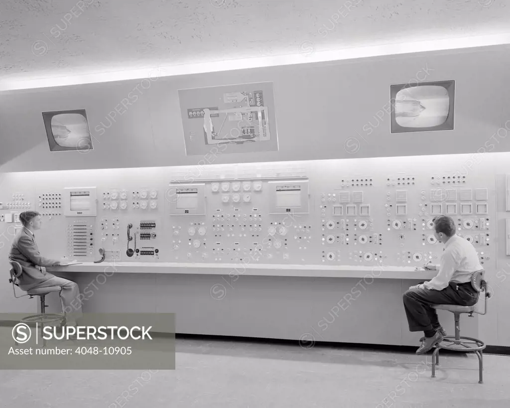 Control room of the Wind Tunnel at Lewis Flight Propulsion Laboratory. TV monitors show the aircraft models during wind tunnel tests. Oct. 17, 1955.