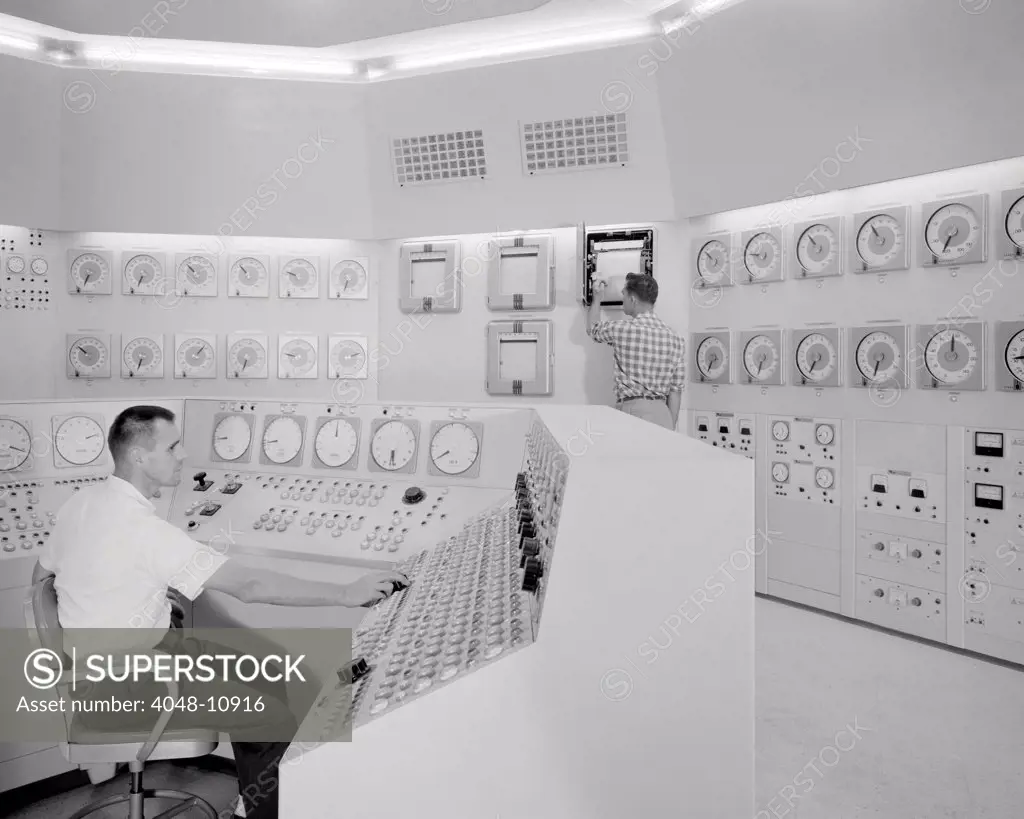 Technicians in a nuclear reactor control room at NASA's Plum Brook Station in Sandusky, Ohio. 1959.