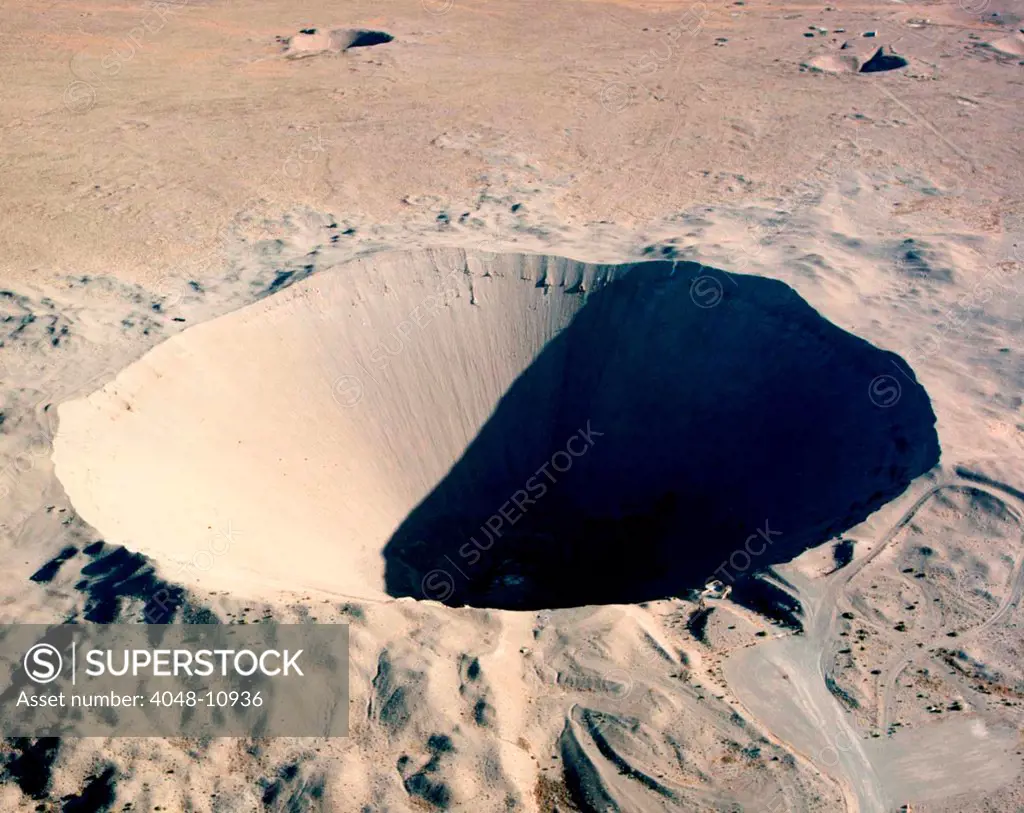 Sedan Crater at the Nevada Test Site. On July 6, 1962 a 100 kiloton nuclear explosion 635 feet underground displaced 12 million tons of earth. The crater was 320 feet deep with 1,280 diameter.