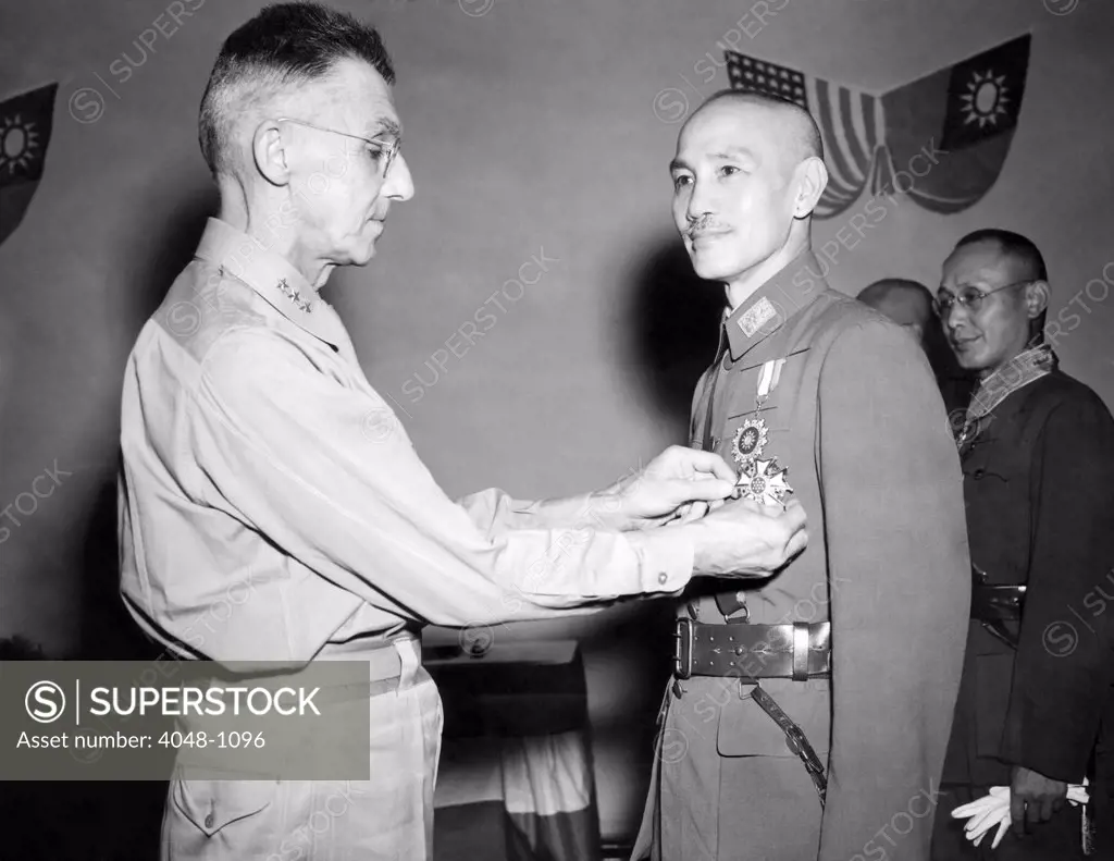 Lt. General Joseph W. Stillwell gives General Chiang Kai-shek the Legion of Merit medal, 1943