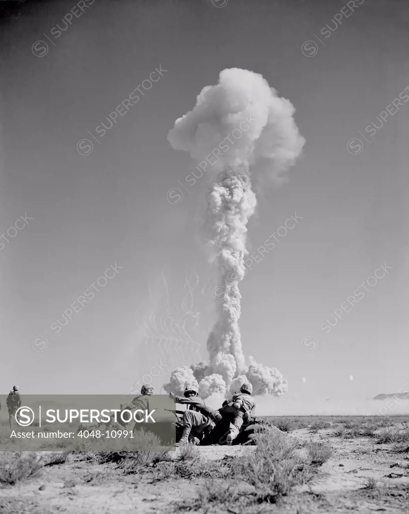 US Marines in battle exercises during atomic bomb testing. Over 2,000 soldiers participated in BEE Shot on March 22, 1955 at Yucca Flat, Nevada.