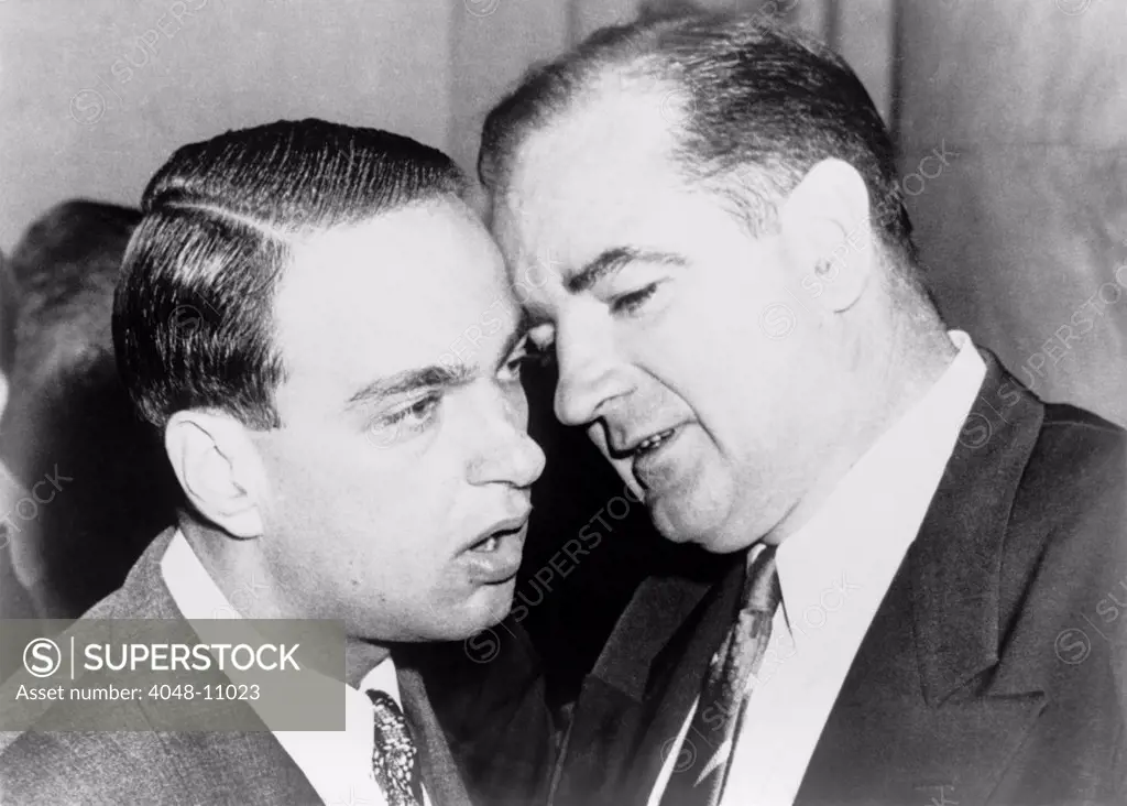 Senator Joseph McCarthy and his chief consul, Roy Cohn whispering during the Army-McCarthy hearings. June 11, 1954.