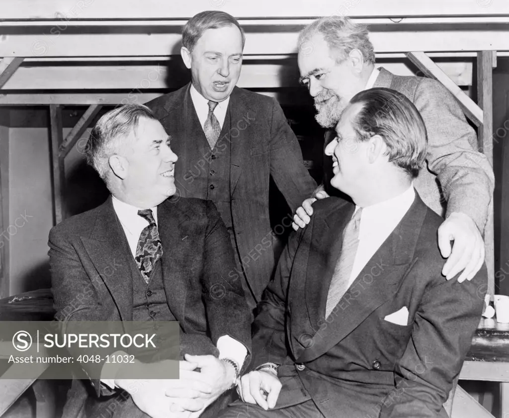 Progressive Party members in 1947. L-R seated are Former VP, Henry Wallace and FDR's son, Elliott Roosevelt, standing are astronomer, Harlow Shapley, and sculptor, Jo Davidson. 1947.