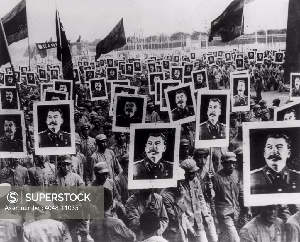 Joseph Stalin celebrated in Red China. Chinese demonstrators with portrait posters of Stalin on the first anniversary of the founding of the Chinese People's Republic, 1951.