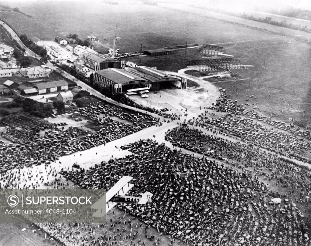 A view from the air of the huge crowds gathered at the Croyden Airdrome to greet Captain Charles A. Lindbergh when he flew the Spirit of St. Louis across the English Channel from Paris to England in 1927