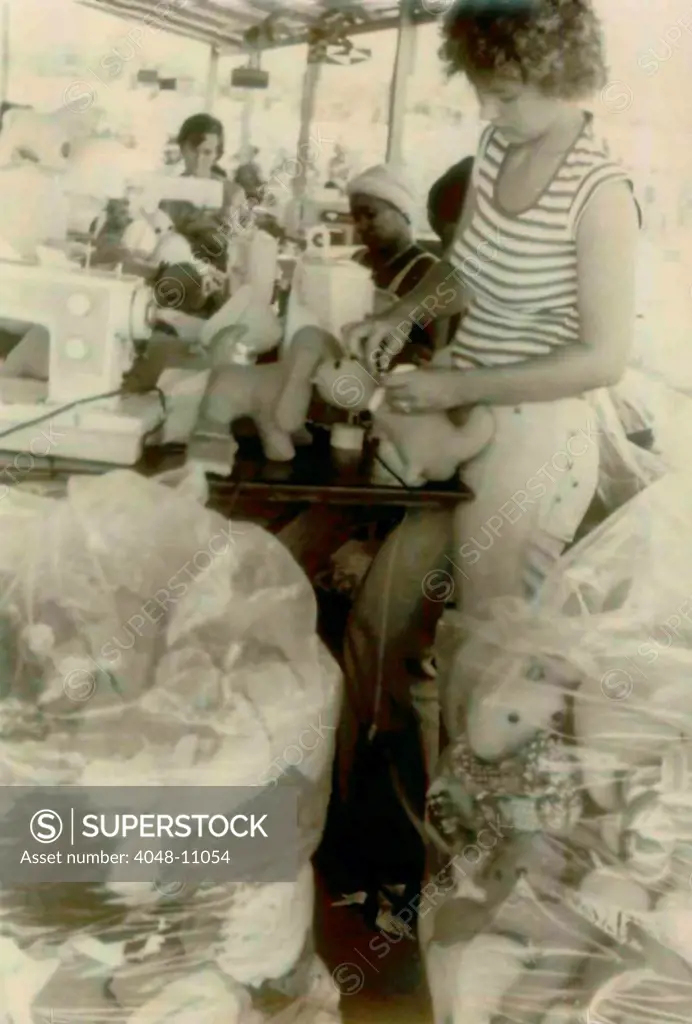Barbara Cordell and Erin Leroy and others working on stuffed animal production. People's Temple Agricultural Project. Jonestown, Guyana. Nov. 1978.