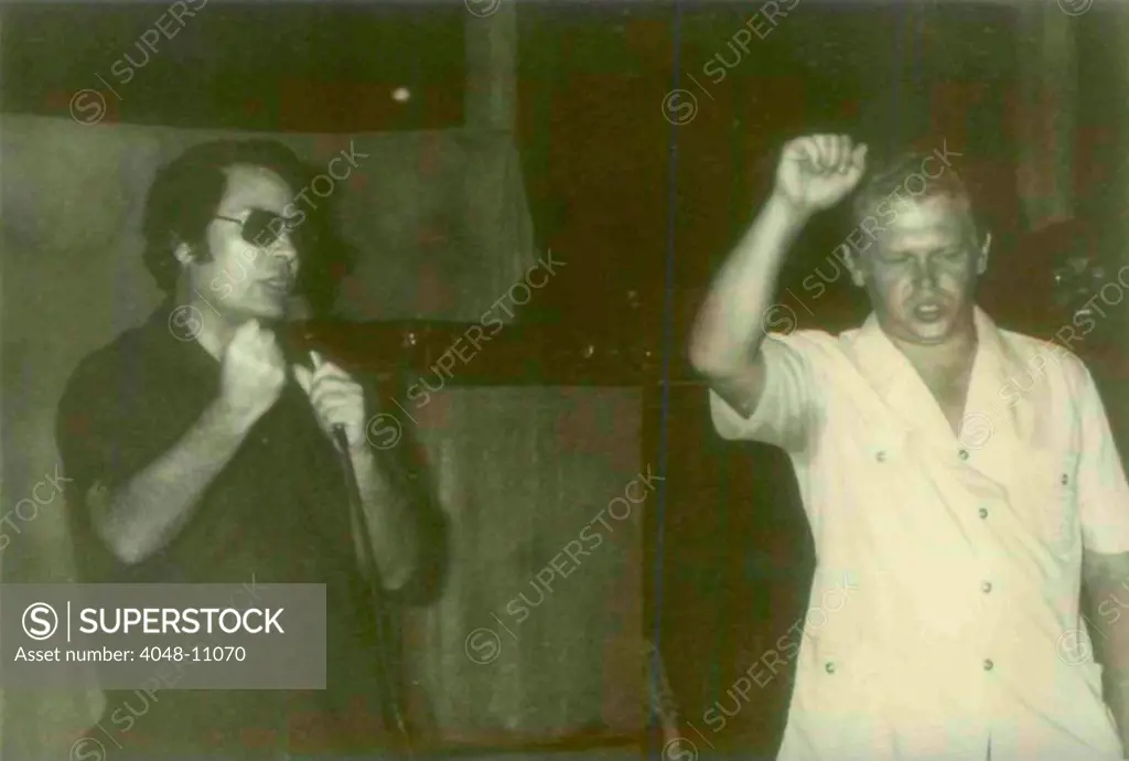 Jim Jones with a guest in Jonestown with visitors that accompanied Congressman Leo Ryan to Jonestown. People's Temple Agricultural Project. Jonestown, Guyana. Nov. 1978.