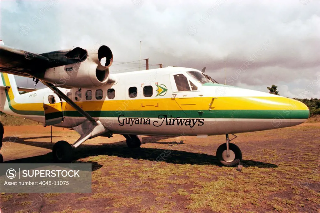 Guyana Airways plane at Port Kaituma airstrip. The plane has bullet holes made during the shooting of the Congressman Ryan party. FBI investigation photo. Nov. 1978.