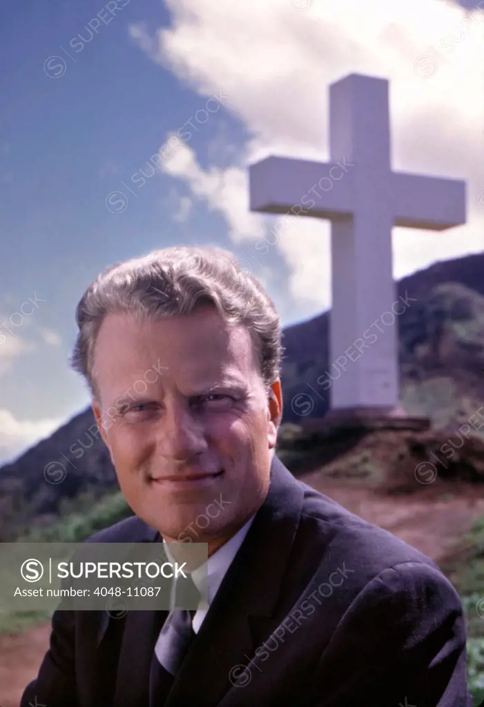 Billy Graham in front of the Kolekole Cross at the U.S. Army's Schofield Barracks at Kolekole Pass, Oahu, Hawaii, 1963. Photo: John G. Zimmerman Archive/Courtesy Everett Collection