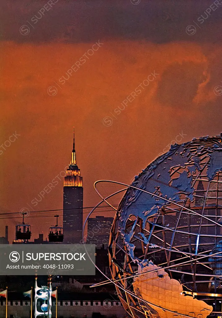 View of the 1964 World's Fair in New York at sunset with the Unisphere and the Empire State Building. Taken from atop the Fair's Better Living Pavillion, Flushing Meadow Park, Queens, New York. Photo: John G. Zimmerman Archive / courtesy Everett Collection