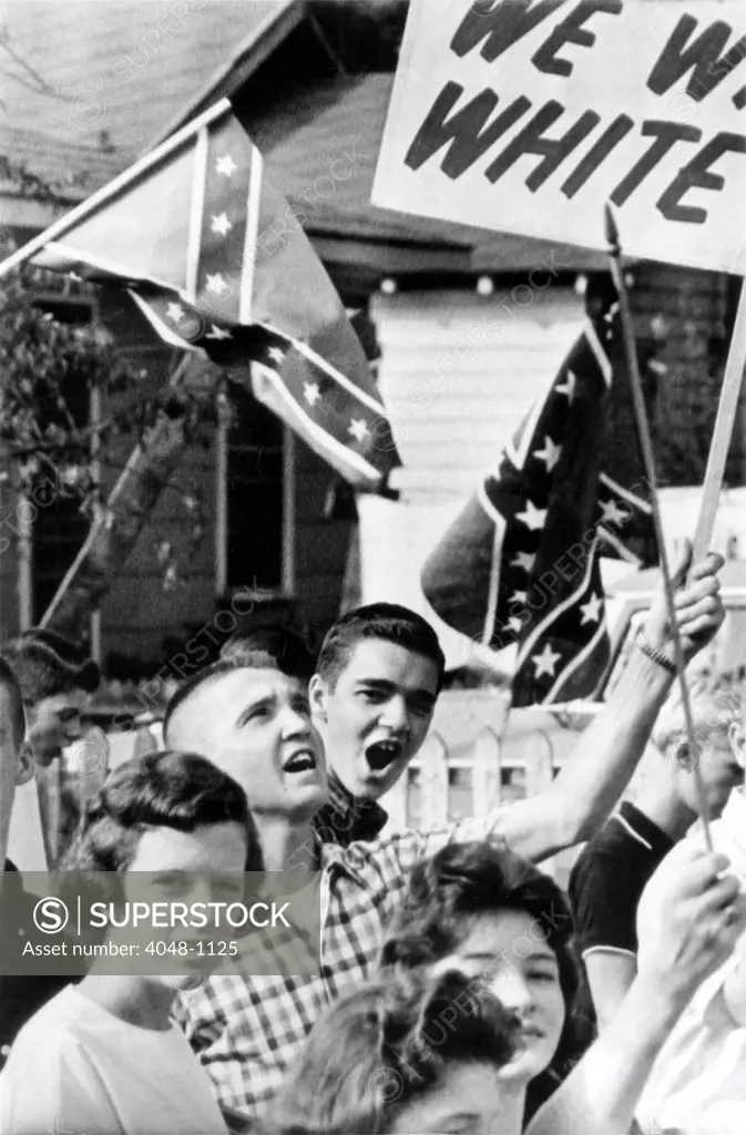 Birmingham, Alabama: Students wave confederate flags and carry anti-integration signs as they stage demonstration near West End High School, 9/11/63. It is the second day of integrated classes in Birmingham City Schools, 9/11/63.