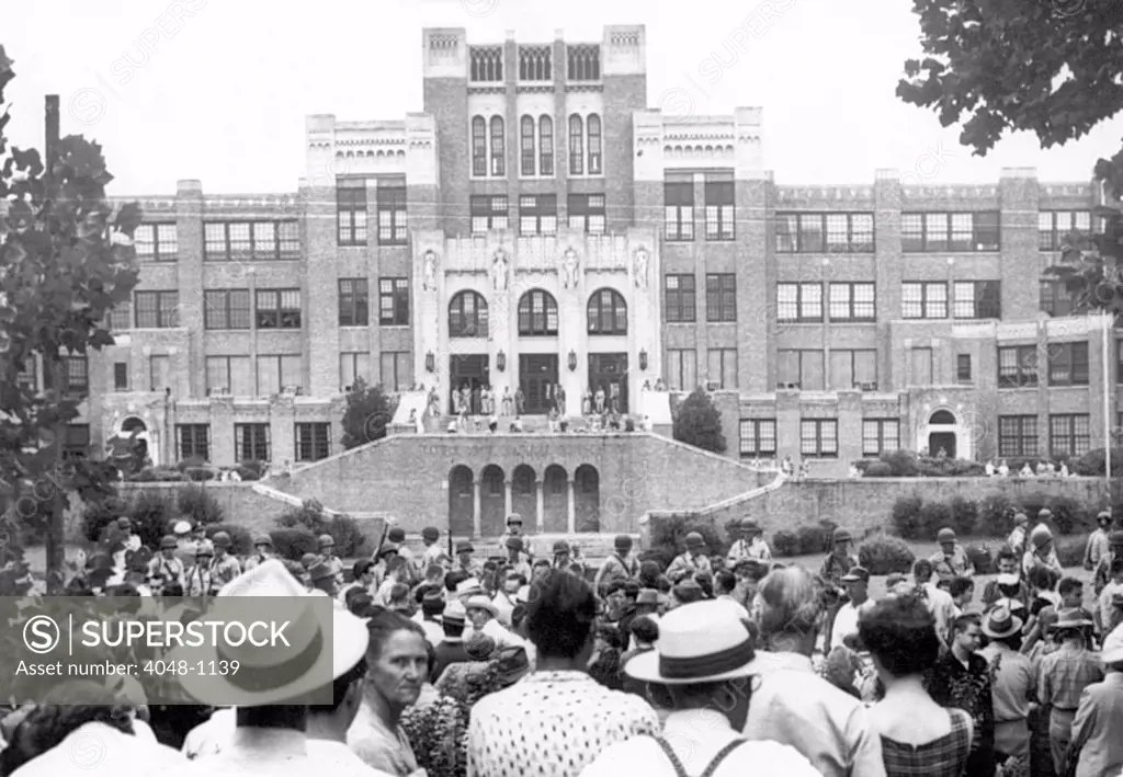 Crowd gathered in front of Little Rock Central High School as National Guardsmen barred black students from entering the school, 09/03/1957
