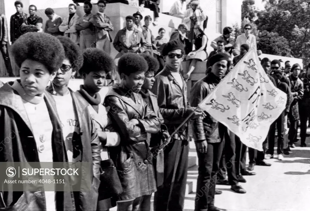 Black Panther Party members show their support for leader Huey Newton at the Alameda County Courthouse in Oakland, California. Huey was charged with killing a police officer, 1968
