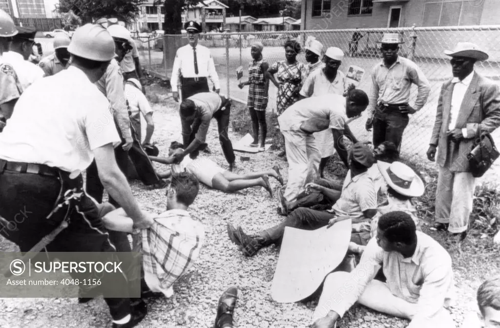 Police arrest civil rights demonstrators in Jackson, Mississippi, June 1965