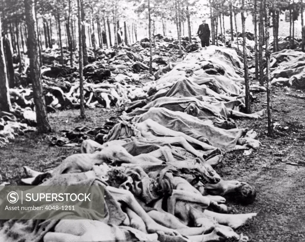 Dead prisoners piled outside Belsen concentration camp, 1945