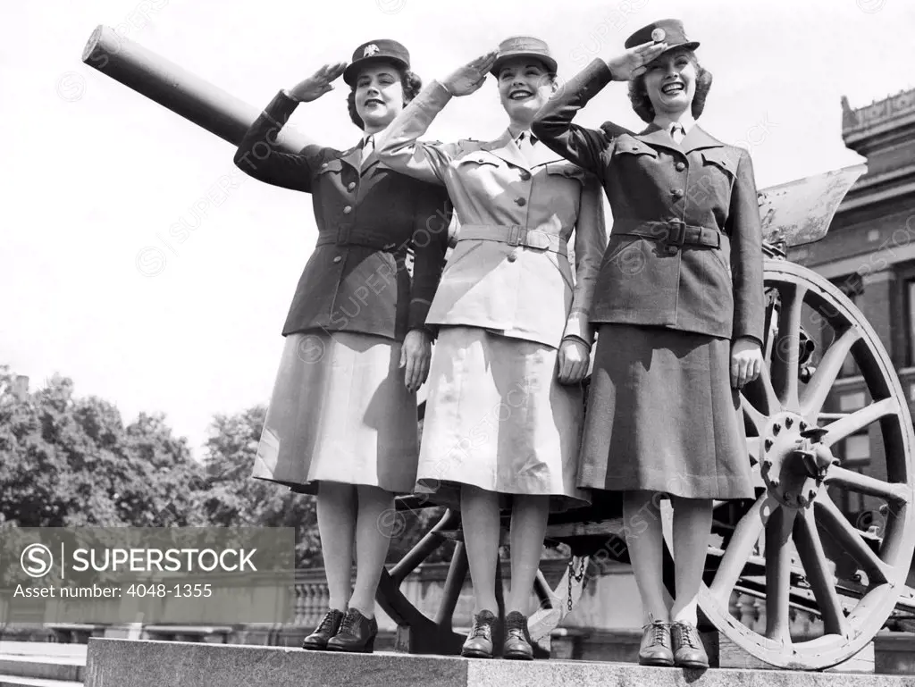 Gloria Pickett, Jane Greer (then Bette Jane Greer), and Inga Rundvold, modeling the uniforms to be worn by the Women's Auxiliary Corps, August 1942, Fort Des Moines, Iowa