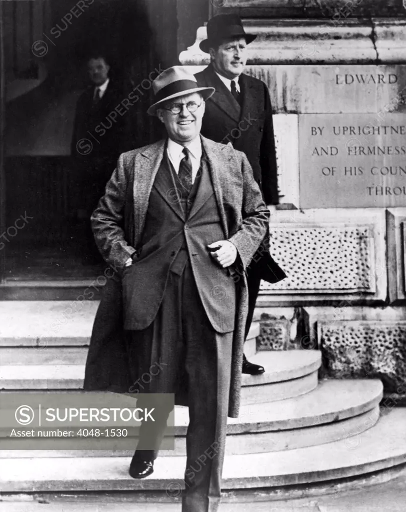LONDON, ENGLAND--Ambassador Joseph Kennedy of the United States is pictured leaving the foreign office here after his visit with Herschel V. Johnson. 3/10/38.