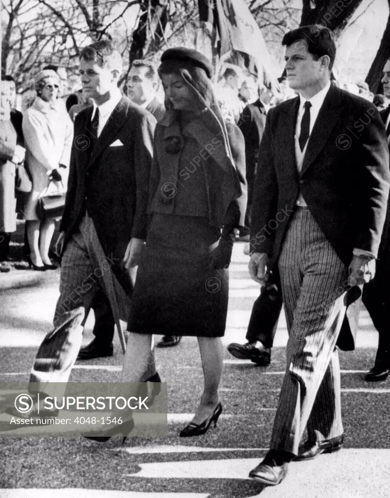 Attorney General Robert Kennedy, Jacqueline Kennedy and Senator Edward Kennedy walk behind President John F. Kennedy's casket, 1963