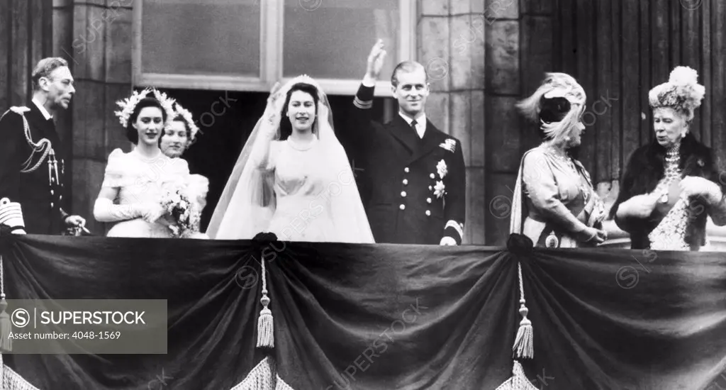 The Royal family gathers on a balcony of Buckingham Palace after Princess Elizabeth's Marriage to Prince Philip. L-R: King George VI (left), Princess Margaret (second from left), Princess Elizabeth (center left), Prince Philip (center right),  Queen Elizabeth (second from right), Queen Mary (right), November 20, 1947, CSU Archives/Courtesy Everett Collection