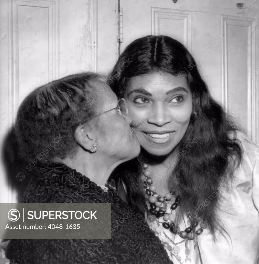 Anna Anderson kisses her daughter, singer Marian Anderson, after a performance of Verdi's 'The Masked Ball' at the Metropolitan Opera, 1955