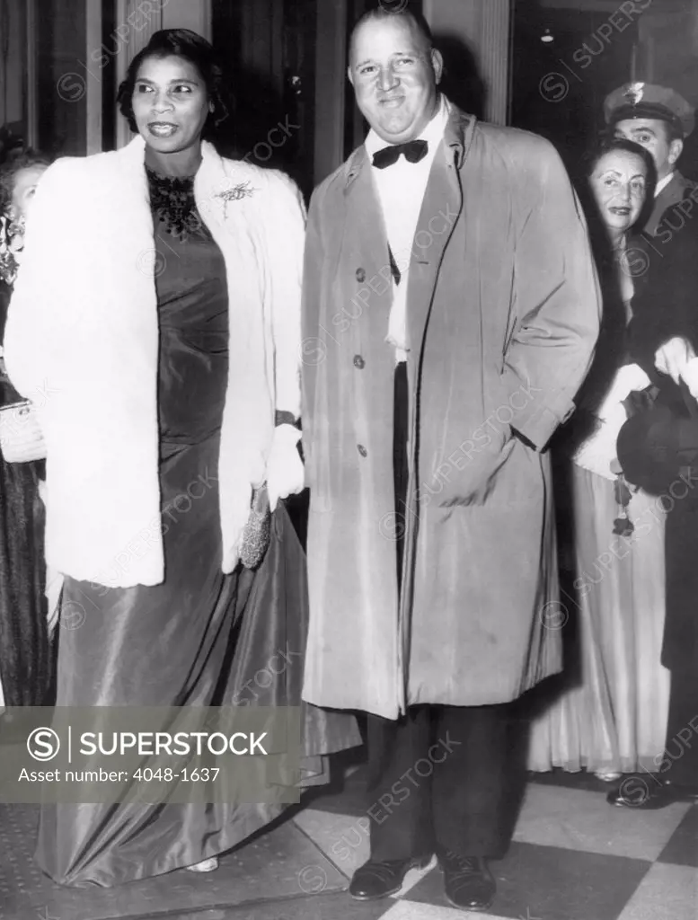 Opera singer Marian Anderson with her husband Orpheus H. Fisher at the opening night of the Metropolitan Opera, 1954