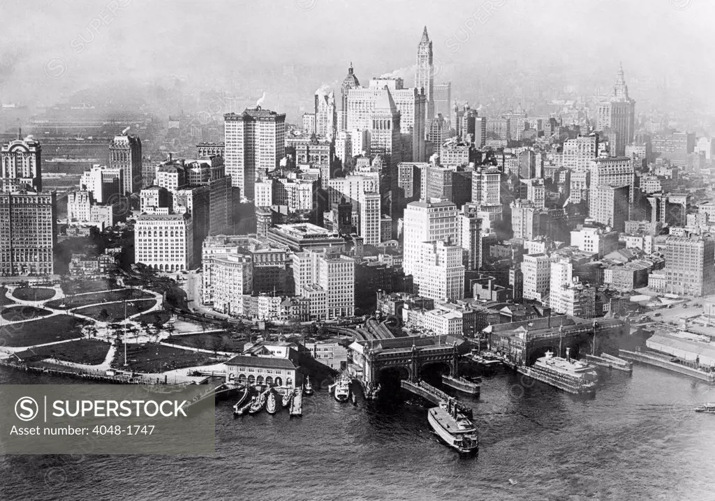 The skyline of downtown New York City, with Battery Park to the left, c. 1915.
